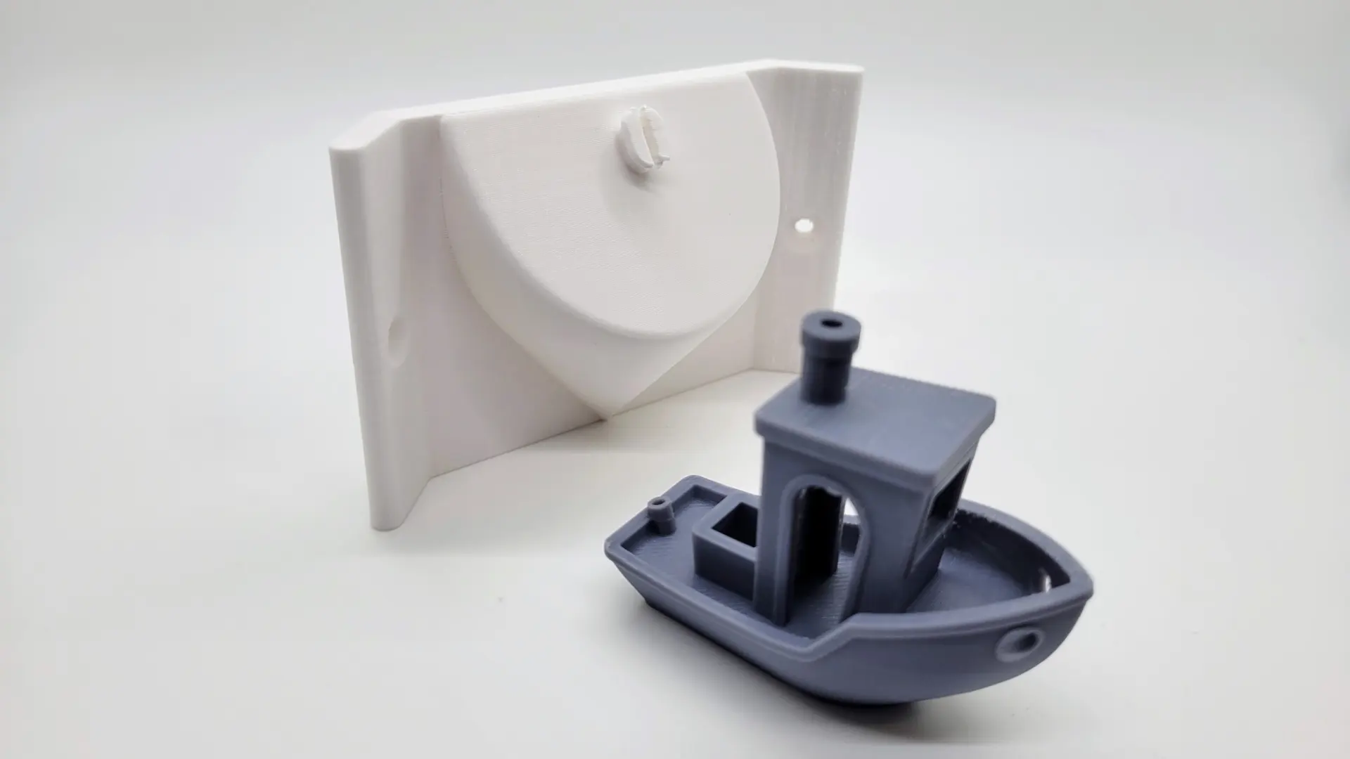 A render of a corner mount for a baby monitor