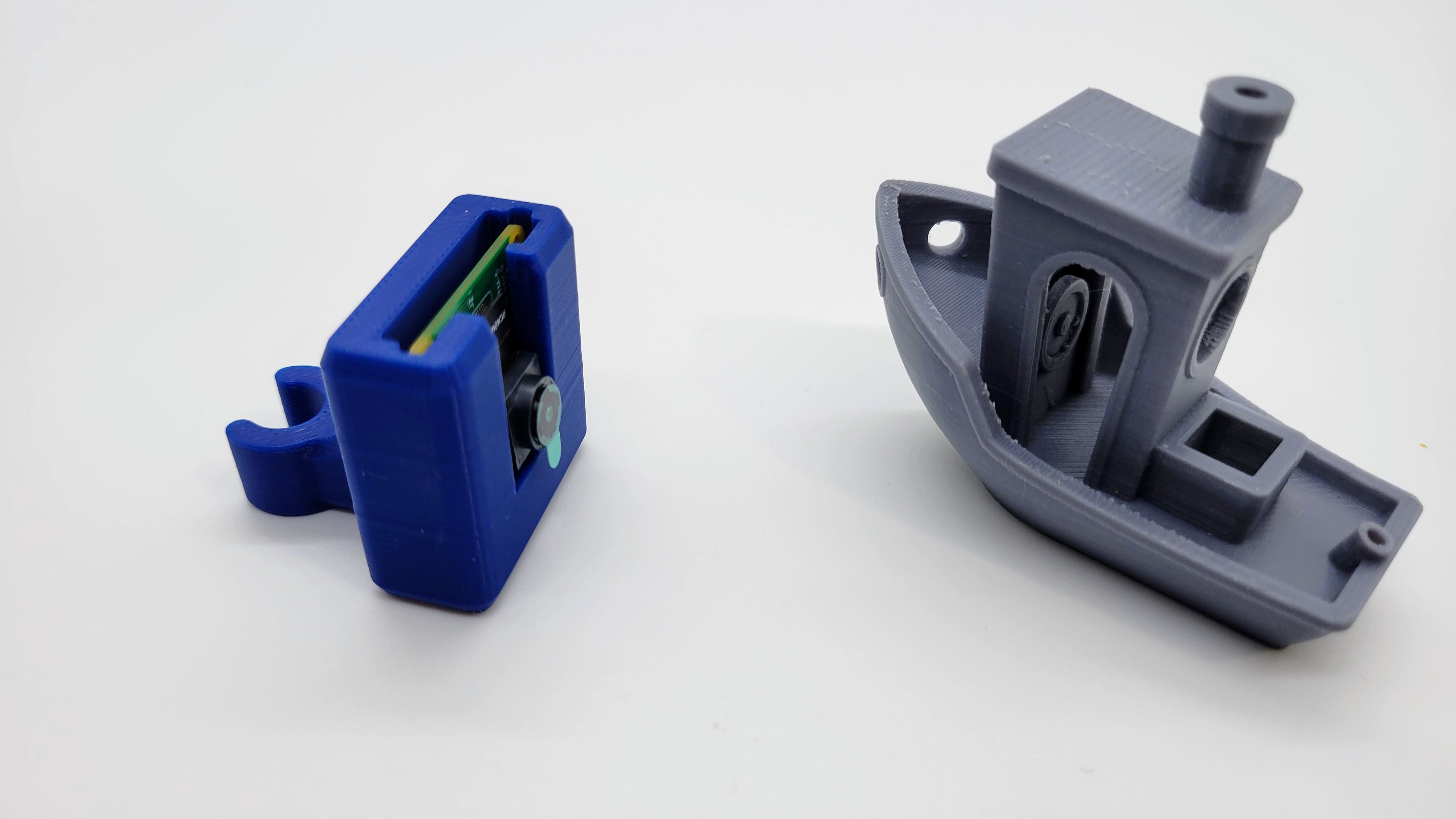 A render of a 3d printed raspbery pi camera for clipping to a printer enclosure pole