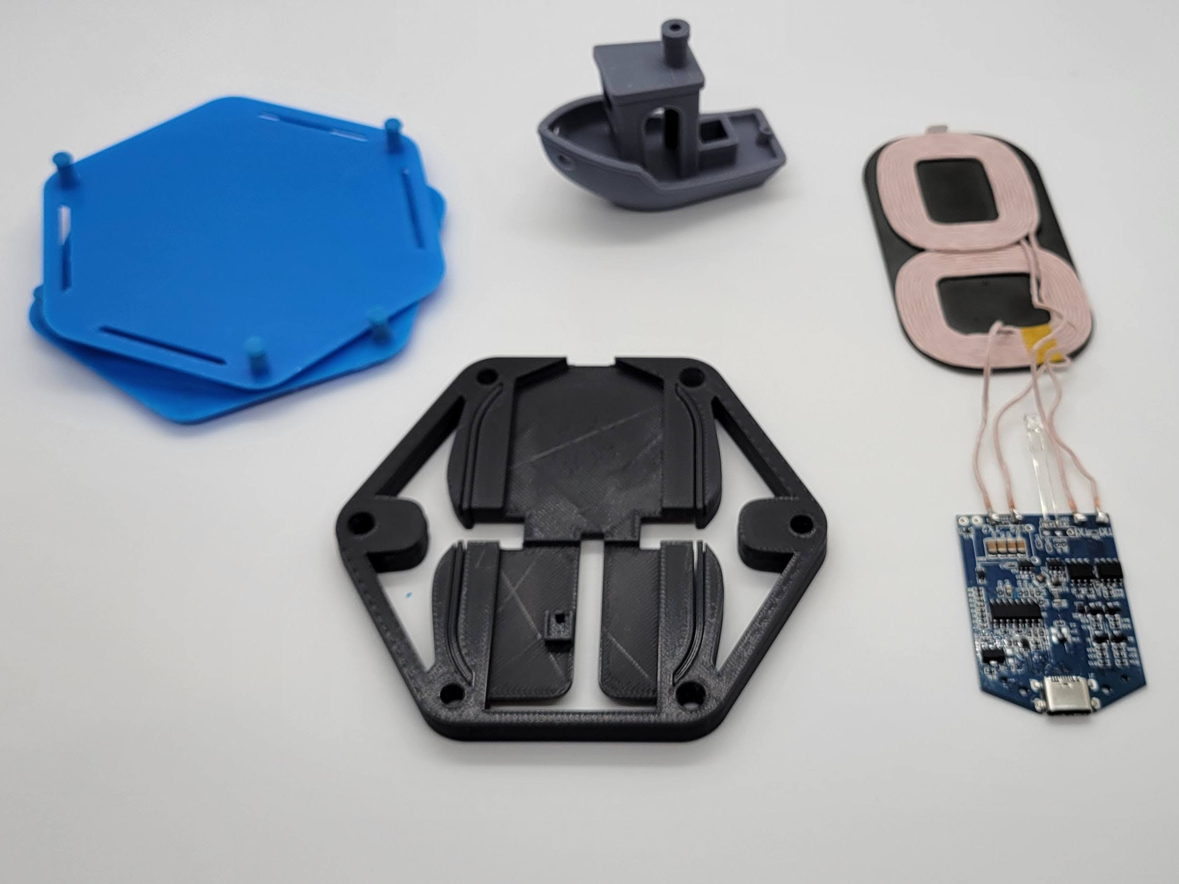 3d printed parts and a wireless charging module, slightly more assembled