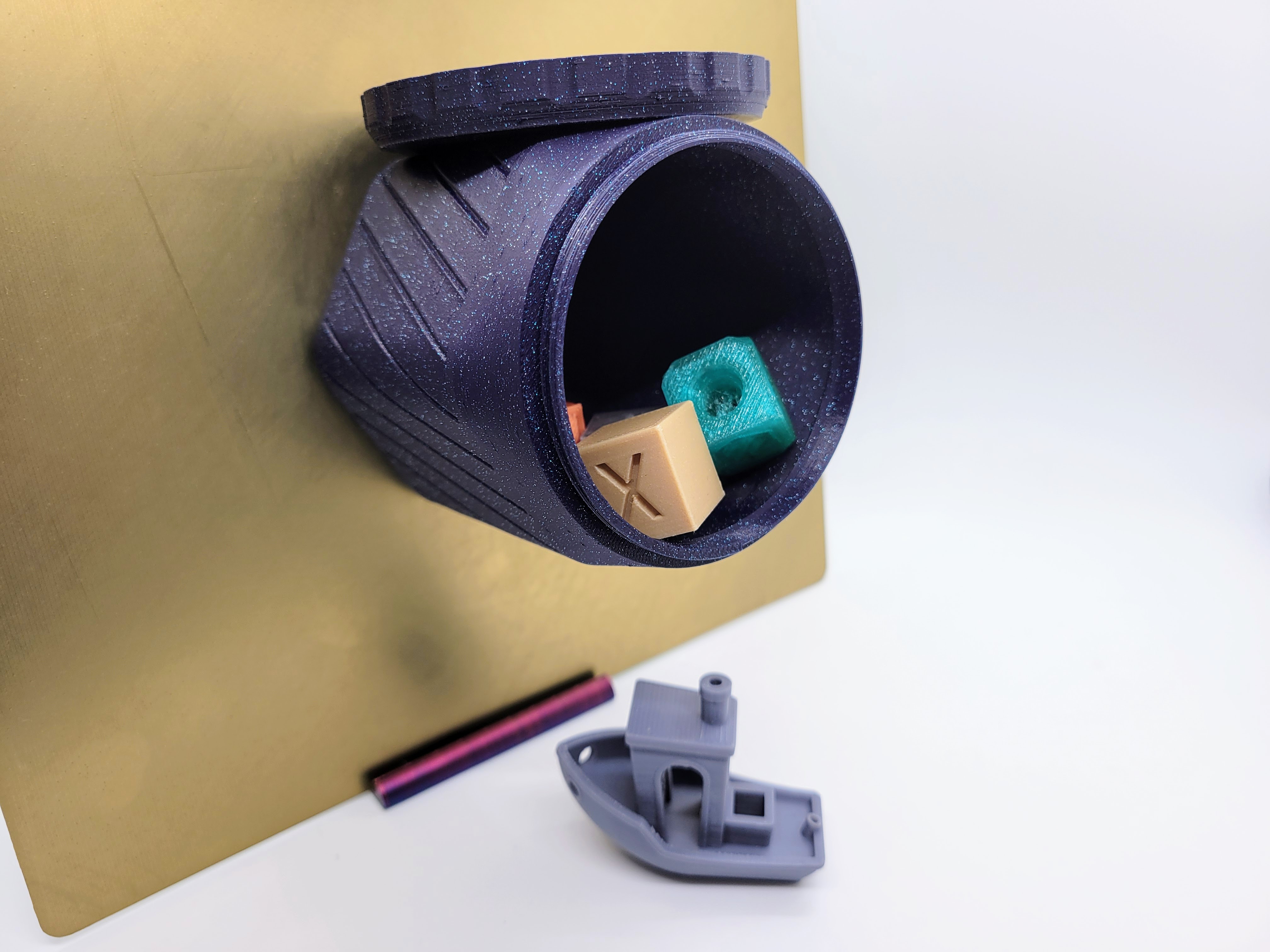 A photo of a 3d printed customizable magnetic base hexagon shaped container featuring a screw on lid