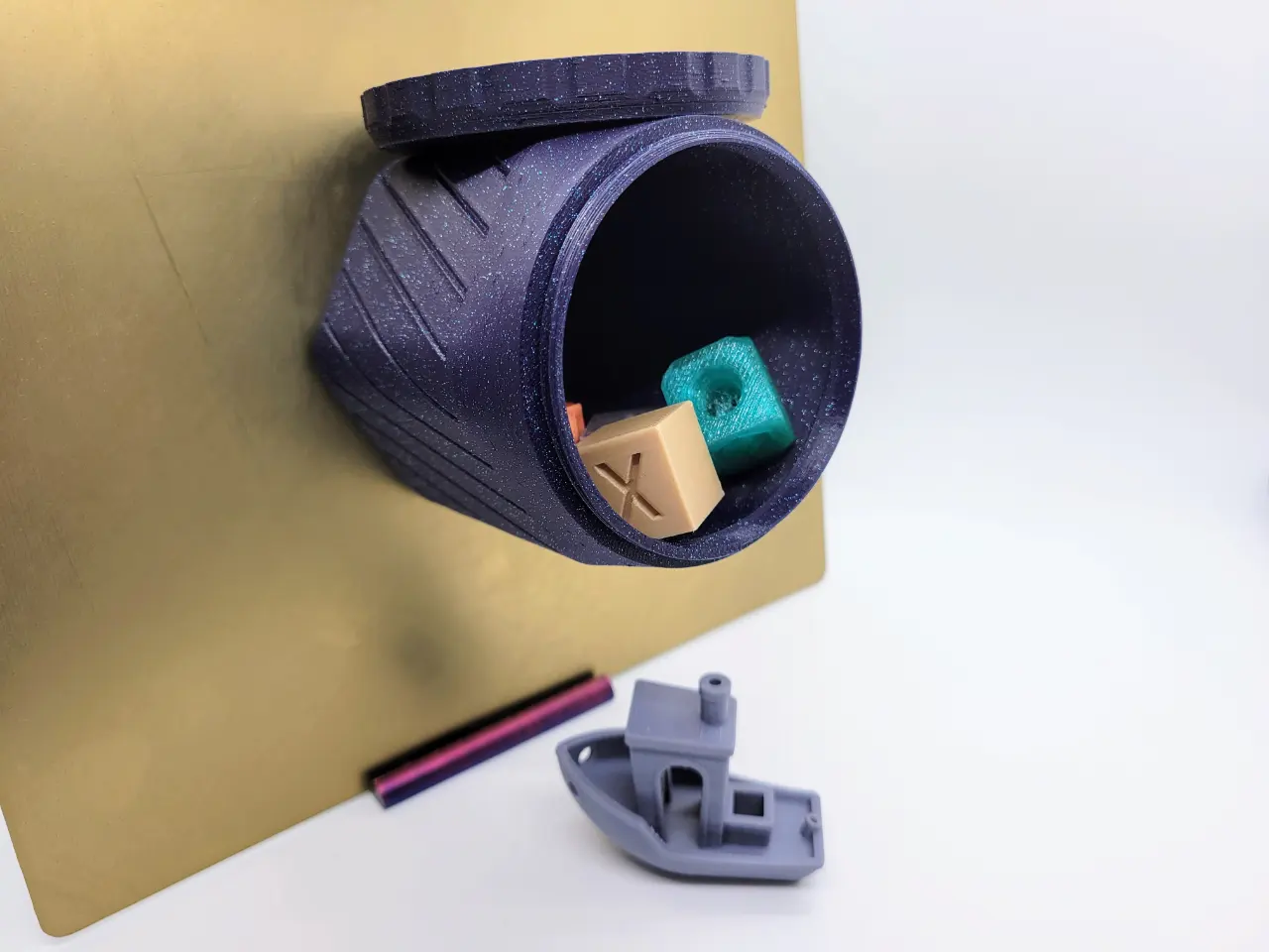 A photo of a 3d printed customizable magnetic base hexagon shaped container featuring a screw on lid