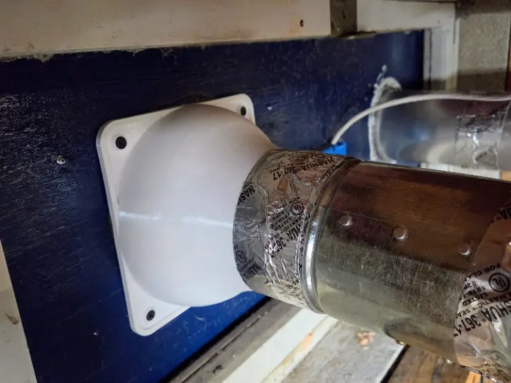 A 3D printed duct reducer connected to a ventilation fan.