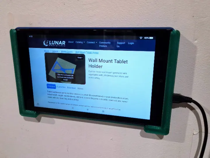 A custom sized 3D printed wall mount tablet holder.
